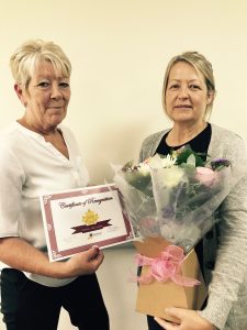 Nicola Hilliard receives her award from Liz Hughes.